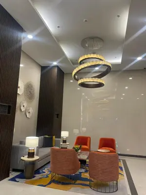 a living room with a couch and chairs at Cozy 3BR near Airport and Okada in Manila