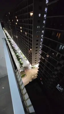 a view of a tall building at night at Shore 3 staycation in Manila