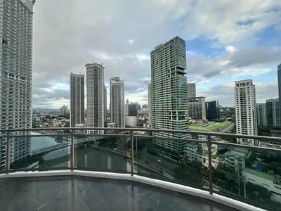 a view of a city skyline with tall buildings at Amira Luxury at Novotel Suites Manila near Makati and BGC in Manila