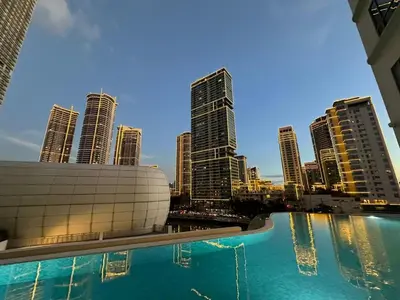 a view of a city skyline from a swimming pool at Amira Luxury at Novotel Suites Manila near Makati and BGC in Manila