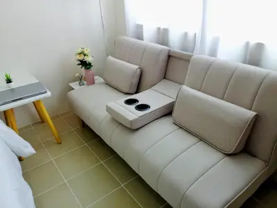 a living room with a couch and a table at 1BR Covent Garden South Tower University Belt- SM Sta Mesa, Metro Manila,Philippines in Manila
