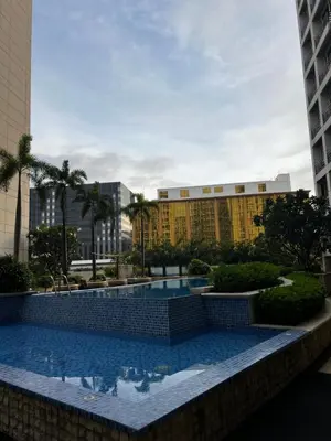 a large swimming pool in front of a building at Faerydae Suites - Free Pool Access in Manila