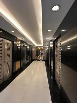 a long hallway with a row of lockers at Faerydae Suites - Free Pool Access in Manila