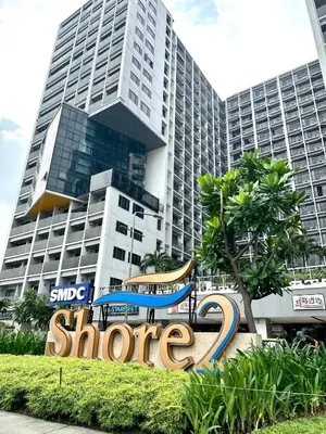 a sign in front of a large building at Casa Nette in Manila