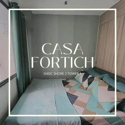 a sign that reads casa tortilli with a bed at Casa Nette in Manila