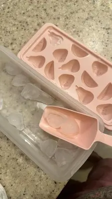 two plastic containers sitting on top of a counter at Casa Nette in Manila