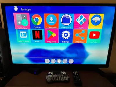 a computer monitor with a keyboard and a remote control at SMDC Apartment Ortigas in Manila