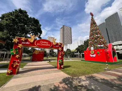 a christmas tree in a park in a city at Central Ortigas Center Condo in Manila