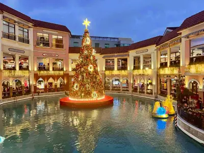 a christmas tree in the middle of a mall at Perfect Location BGC - Mckinley in Manila