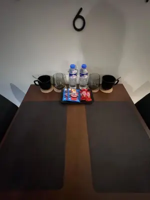 a table with two bottles of water on it at 81 Newport Blvd Cluster 5 Unit 4E by Rechelle Nunag in Manila