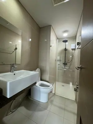 a bathroom with a sink and a toilet and a shower at Alaya Place - Palm Tree II - in front of NAIA 3 in Manila