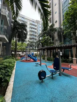 a playground with a slide and swings at Alaya Place - Palm Tree II - in front of NAIA 3 in Manila