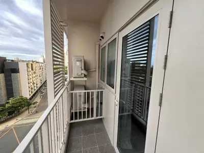 a balcony with a view of a city at Holiday suite at Park Mckinley West in Manila