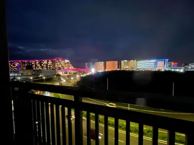 a view of a city at night with lights at Gentry Manor Near MOA&Airport WiFi TV Netflix Okada view 6Q in Manila