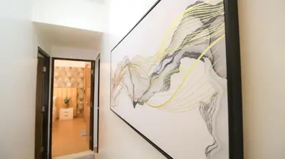 a painting of a horse on a wall in a hallway at Cylo's Place Manhattan in Manila