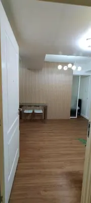 an empty room with a table and a bench at Azure Family Room Condo Unit in Manila