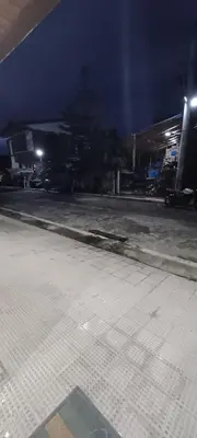 an empty parking lot at night with a parking garage at Family Unit at Mary's Staycation in Tanza Cavite Condo Type good for 4 person in Tanza