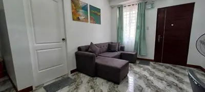 a living room with a couch and a chair at Family Unit at Mary's Staycation in Tanza Cavite Condo Type good for 4 person in Tanza