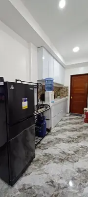a kitchen with a black refrigerator in a room at Family Unit at Mary's Staycation in Tanza Cavite Condo Type good for 4 person in Tanza