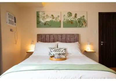 a bedroom with a bed with a bowl on it at The Bay Nest in Manila