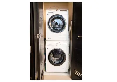 a washer and dryer in a small room at The Bay Nest in Manila