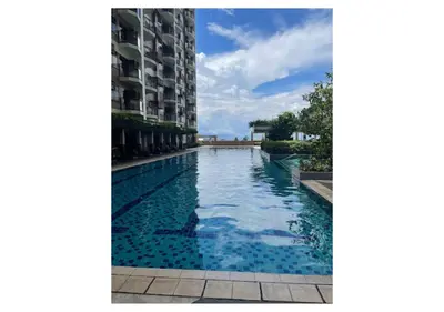 a swimming pool in the middle of a building at The Bay Nest in Manila
