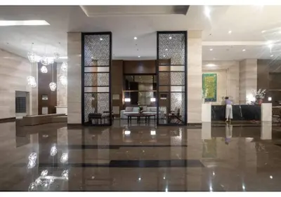 a lobby of a hotel with a large room at The Bay Nest in Manila