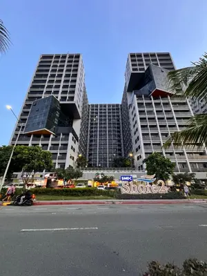 two tall buildings in a city with a street at La Chicka Staycation -1292 in Manila