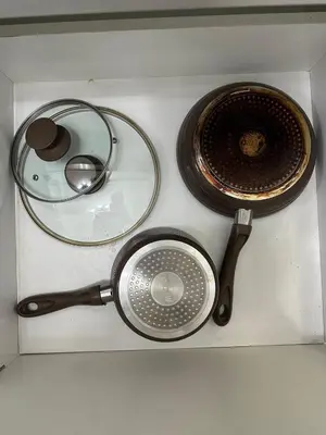 a sink with a strainer and a pot and a strainer at Uno Tahanan Azure in Manila
