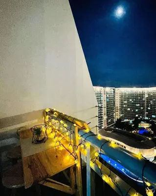 a balcony of a cruise ship at night at Uno Tahanan Azure in Manila