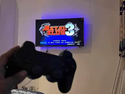 a person holding a video game controller in front of a tv at Staycation in Azure Paranaque in Manila