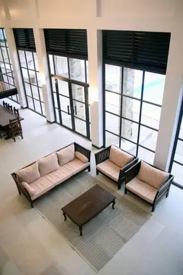 a living room with two couches and a coffee table at Villa Ariana Family Getaway in Bukal