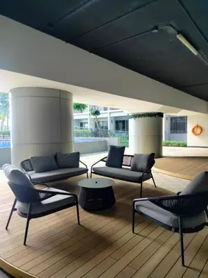 a living room with two couches and a coffee table at StayWise Space Manila in Manila