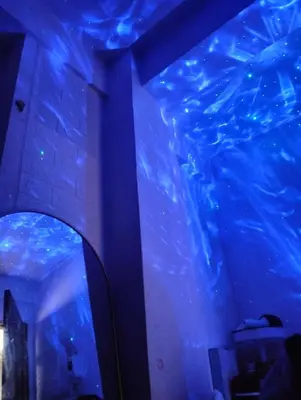 a room with a blue ceiling and a mirror at Shore Residences C1 in Manila