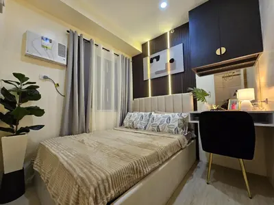 a small bedroom with a bed and a desk at NEAR NAIA TERMINAL 1, 2, 3 Cozy Apartment at Field Residence in Manila