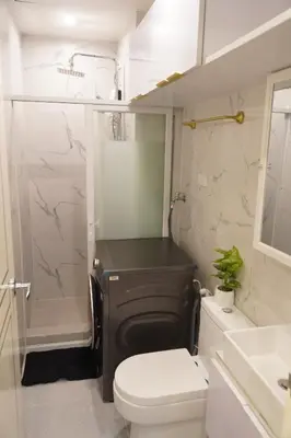 a bathroom with a toilet and a shower and a sink at NEAR NAIA TERMINAL 1, 2, 3 Cozy Apartment at Field Residence in Manila