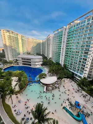 a view of a resort with a swimming pool and buildings at Azure Urban Resort Staycation By J&R in Manila