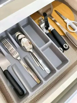 a metal tray with utensils in a drawer at Azure Urban Resort Staycation By J&R in Manila