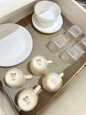 a tray with plates and dishes on a table at Azure Urban Resort Staycation By J&R in Manila