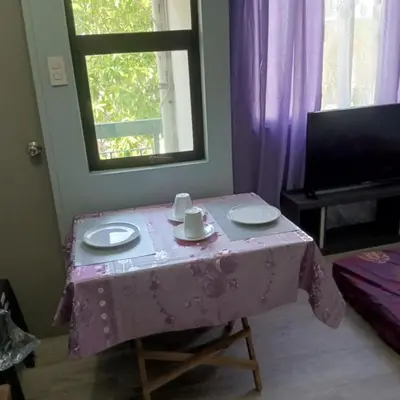 a table with a pink table cloth on it at Josephine Macatula in Santa Rosa