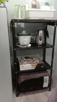 a shelf with a cooker and a coffee pot on it at Josephine Macatula in Santa Rosa