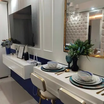 a dining room table with plates and a mirror at Homefort Twin Bed Suite - Red Residences Makati 1146 in Manila