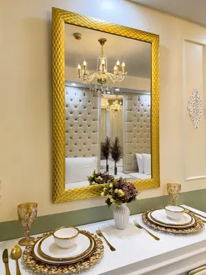 a dining room with a mirror and a table at Homefort Twin Bed Suite - Red Residences Makati 1146 in Manila