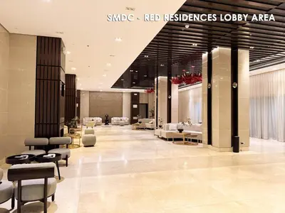 a lobby with chairs and tables in a building at Homefort Twin Bed Suite - Red Residences Makati 1146 in Manila