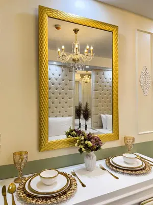 a dining room with a mirror and a table at Homefort Twin Bed Suite - Red Residences Makati 2202 in Manila