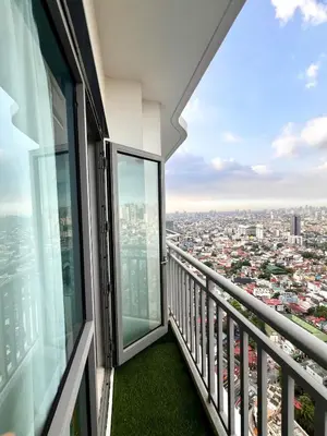 a balcony with a view of a city at Staycation in Mandaluyong near Makati and BGC in Manila