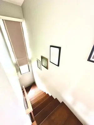 a room with a staircase with two pictures on the wall at Havila, Amarilyo Home, Brgy San Juan, Taytay Rizal in Taytay