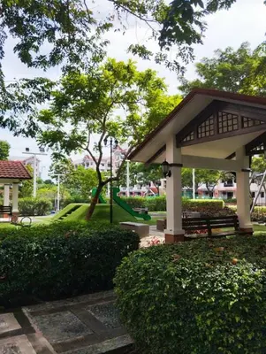 a pavilion with a bench in a park at Life in refinement at Ivory Wood in Manila