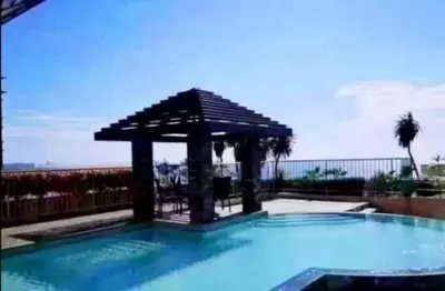 a swimming pool with a gazebo on top of it at FamilyRoom 1 bedroom in Manila