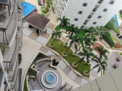 an overhead view of a mall with palm trees and a building at Condo Near MOA and NAIA at SoleMare Parksuites in Manila